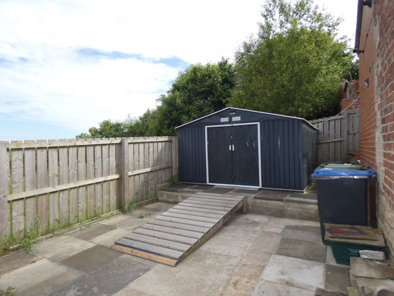 Paved garden to the side- click for photo gallery